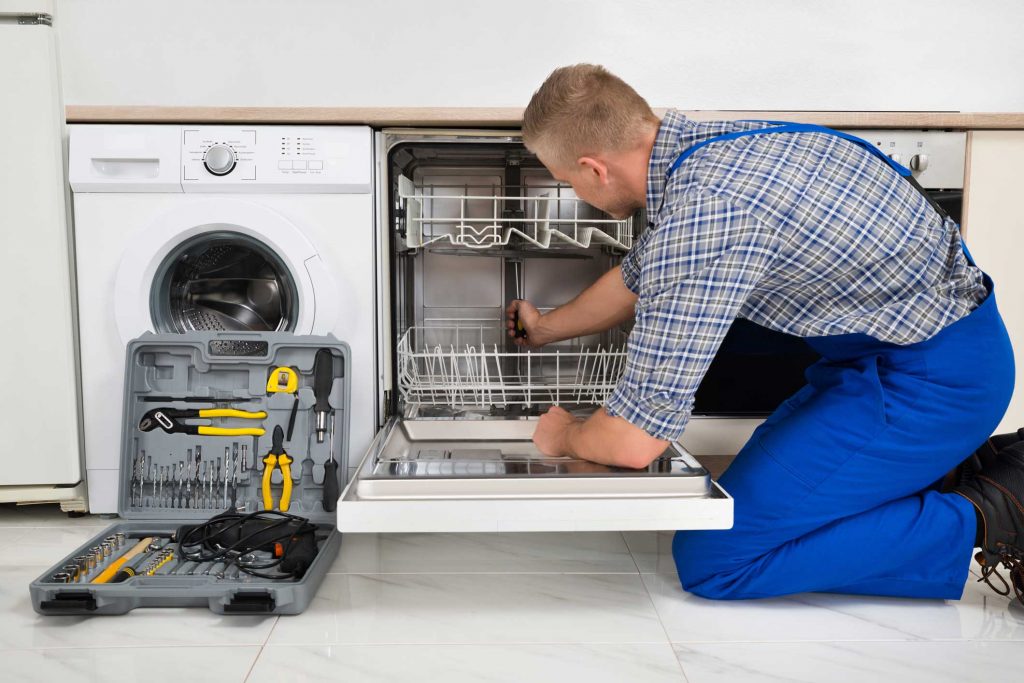 technician fixing a dishwasher repair raleigh