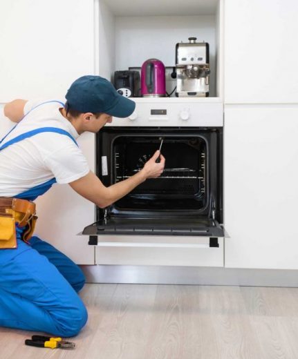 man repairing oven - About Raleigh Appliance Repair Experts - Oven Repair Raleigh